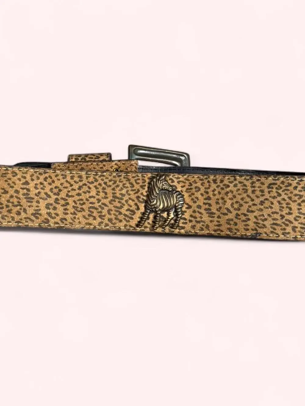 Leopard print western belt with animal accents throughout and chunky buckle!